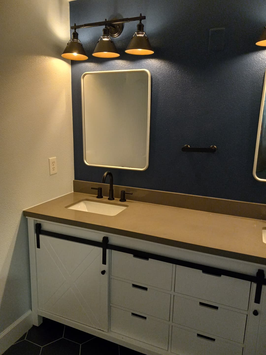 picture of a custom bathroom double sink remodel with custom vanities and lights remodeled in portland, oregon